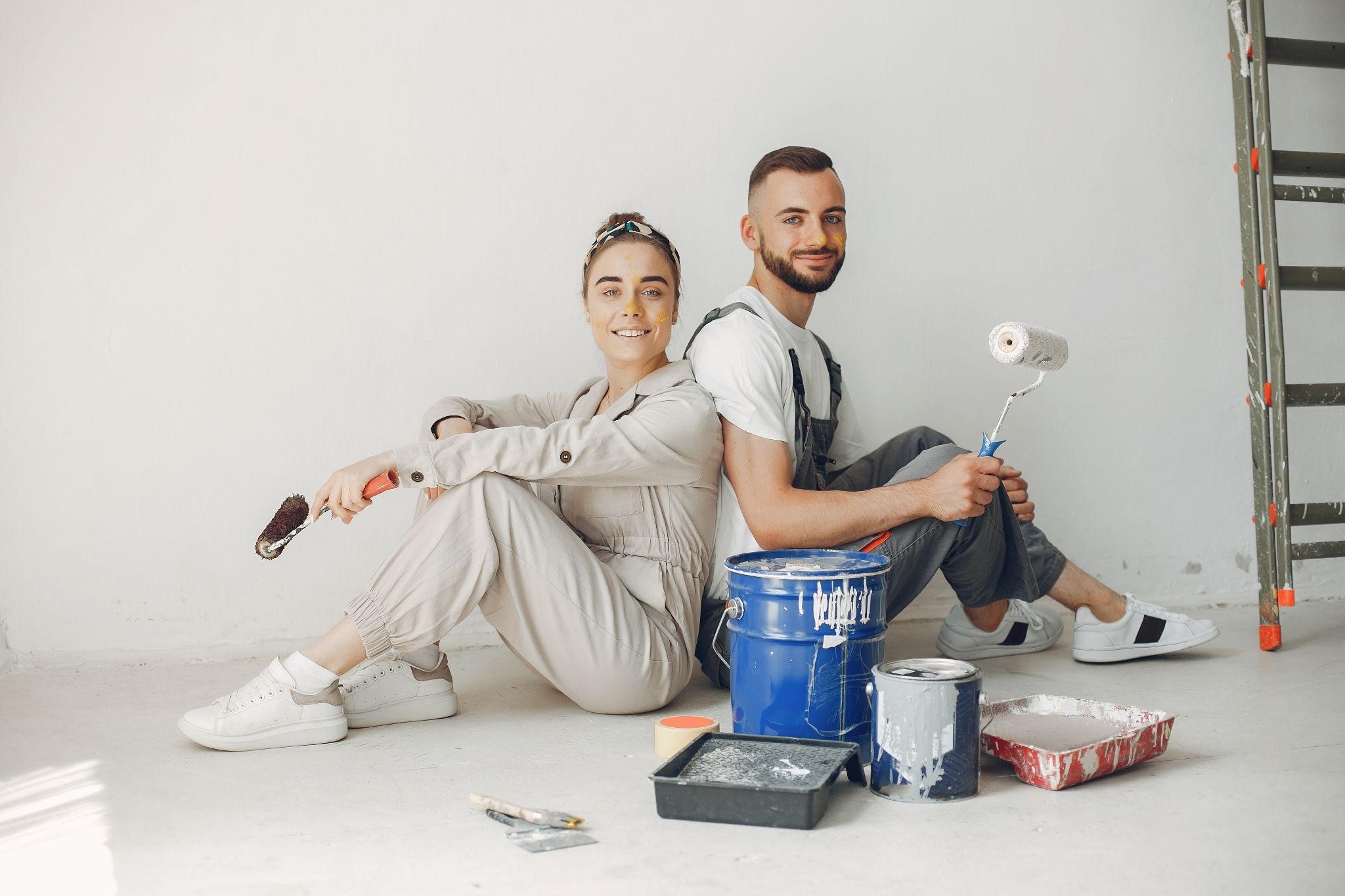 couples painting home after renovation