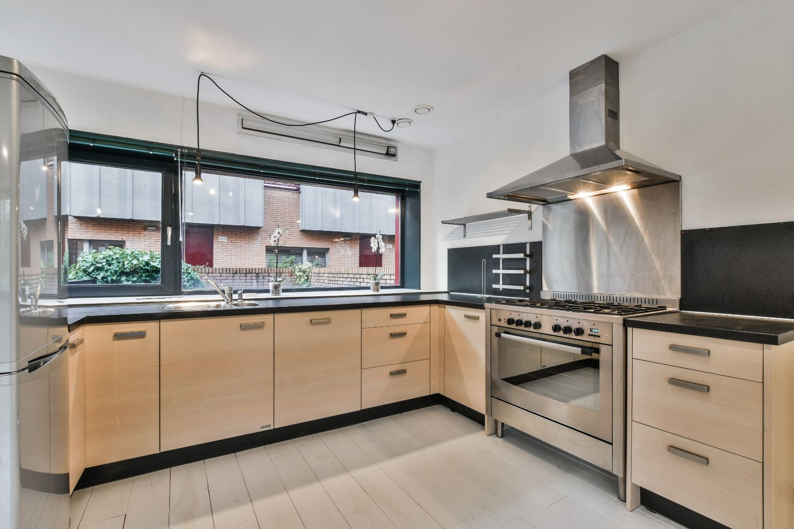 L Shaped kitchen design in san diego with brown color cabinet