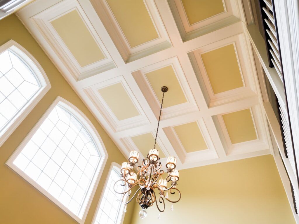yellow and white tray ceiling design for a luxury master suit