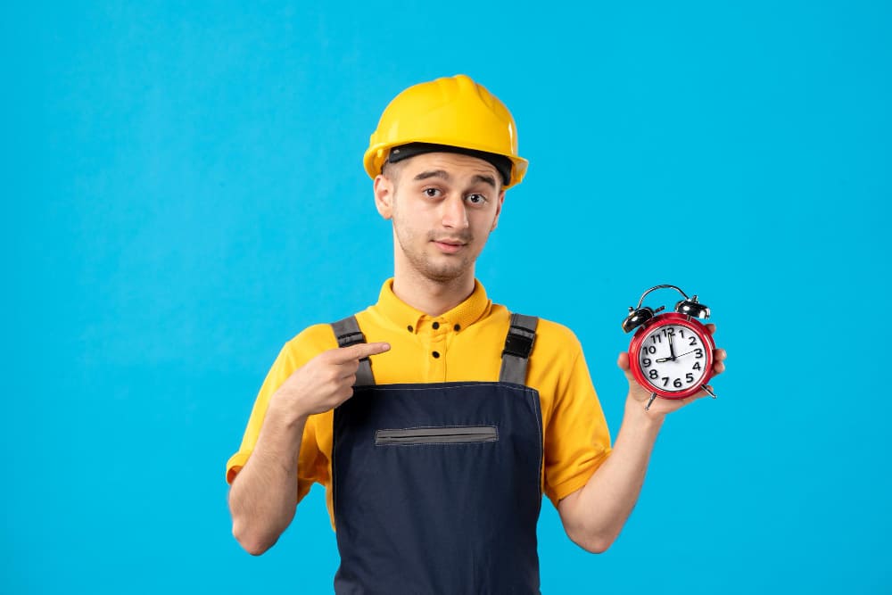 contractor with watch in hand representing garage conversion projects on time