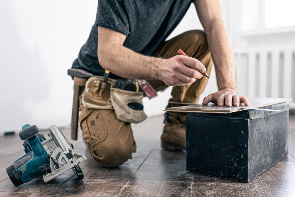 a san diego guy repairing cabinet of home